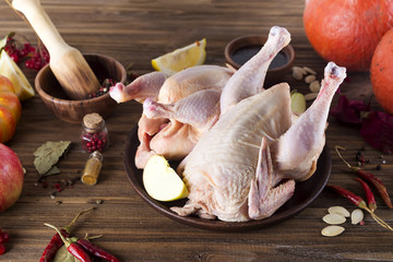 raw chicken fillets on wooden cutting board,