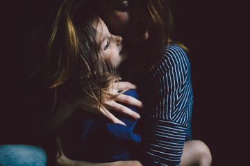 Mother embracing her child