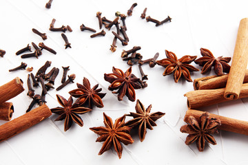 cinnamon, staranise and cloves. winter spices on white background