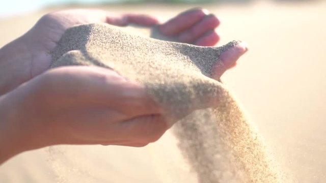 Young woman falling beach sand