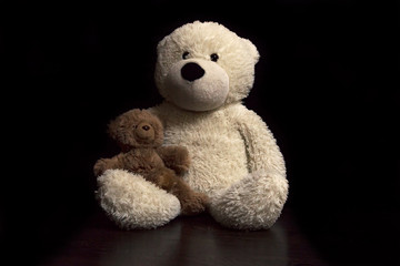 baby toy teddy bears on a black background