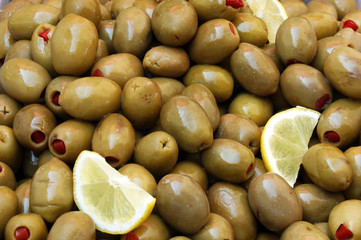 Green stuffed olives with lemon