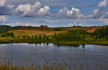 Russian provincial landscape/A series of photos with Russian provincial scenery. Summer, noon, deciduous forest, lake, small houses. Russia, Pskov region, nature, landscape