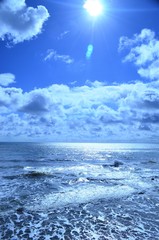 Sunny sea view showing clouds to the horizon