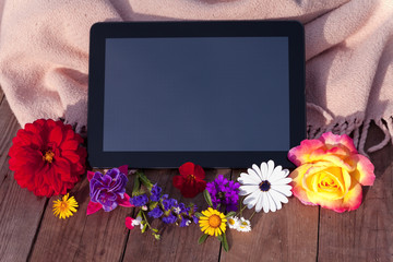 Tablet with flowers.
