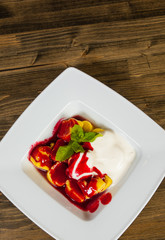 Sweet pumpkin ravioli with banana on a wooden background. with copy space. top view