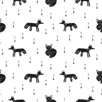 Cute hipster tribal foxes seamless vector pattern. Ethnic black and white animal background with arrows. Kids fabric or wrap paper print design.