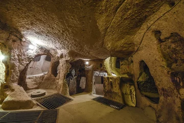 Fototapeten The Derinkuyu underground city is an ancient multi-level cave city in Cappadocia, Turkey. © Mariana Ianovska