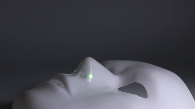 Close up of a white mystique mask 
