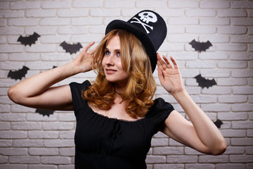 Portrait of young beautiful woman in Halloween hat.  Halloween, celebration, party concept