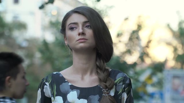 Beautiful girl with braid on street