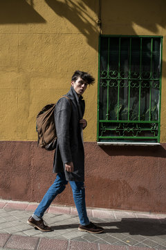 Young man carrying a backpack