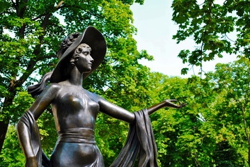 metal sculpture of a lady in a hat