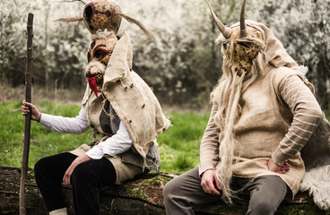 Young peolpe during old slavic festival dressed like forest spirits  