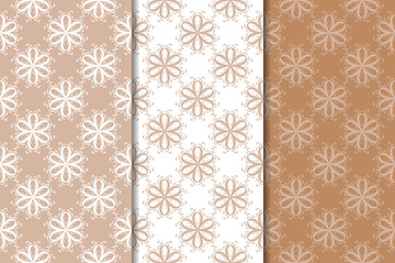 Set of floral ornaments. Brown, beige and white seamless patterns