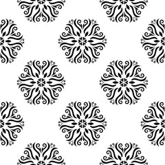 Black floral seamless design on white background