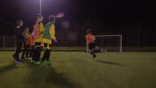 British youth soccer team practice penalties during training