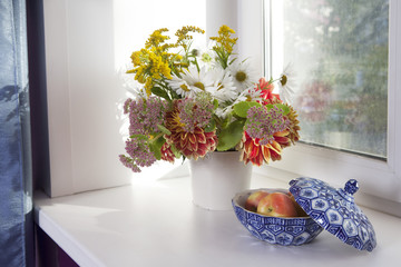 autumn bouquet of daisy, dahlia, sedum, canadensis with apple
