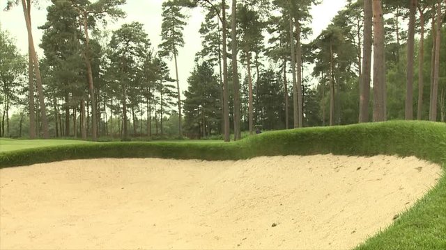 STRight to left slide past a golf bunker