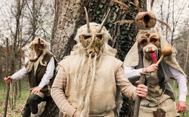 Young peolpe during old slavic festival dressed like forest spirits  