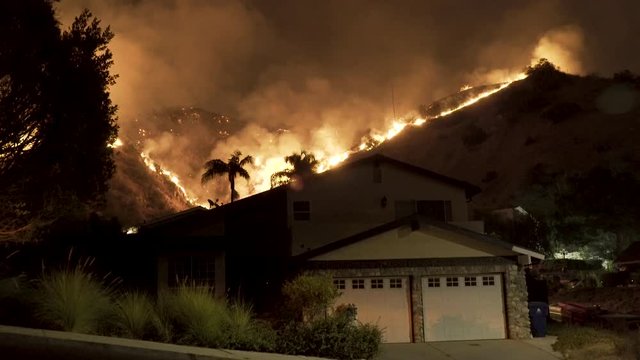 House Surrounded by Wildfire