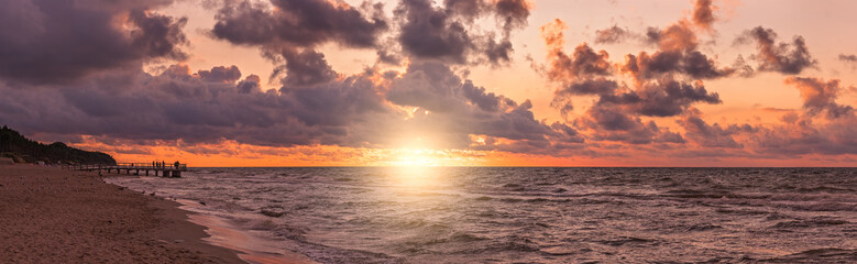 Panorama of a beach sunset over Baltic sea