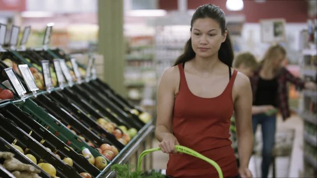 Female customers buying groceries & browsing in the supermarket