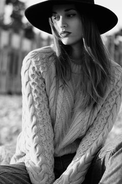 Portrait of beautiful woman with black hat