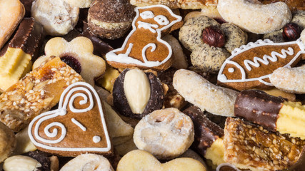 Texture of traditional homemade Christmas cookies. Various shapes and types of sweet pastries in HD ratio 16x9.