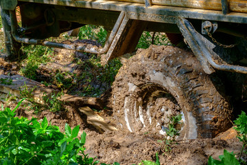 Fototapeta na wymiar Off road wheel stuck in mud.