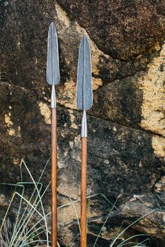 traditional Maasai spears leaning against rock