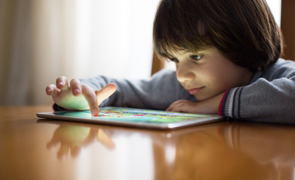 Small boy using a digital tablet