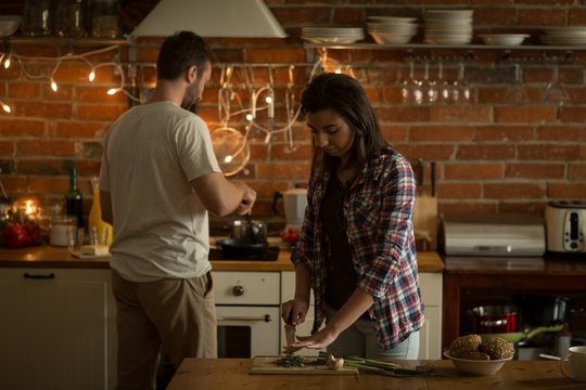 Young couple making food at home