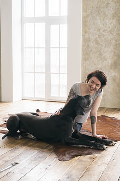 Smiling woman flattering German Dane