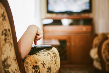 5 years old boy holding a tv remote control