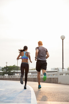 Young couple running together