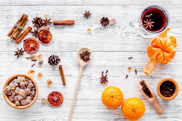Merry christmas in winter evening with warm drink. Hot mulled wine or grog with fruits and spices...