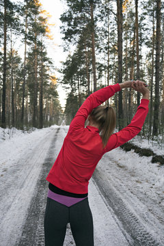 Sportswoman leaning one side at workout