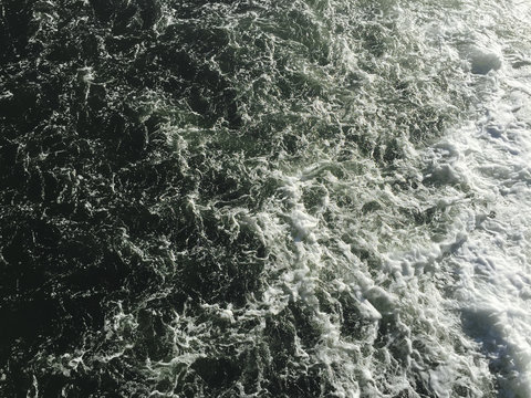 Overhead view of churning ocean water