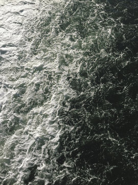 Overhead view of churning ocean water