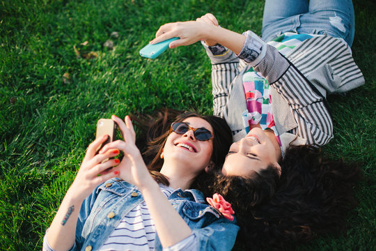 Two female friends having a good time outdoors