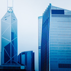 Naklejka premium architectural complex against sky in downtown hong kong,china.