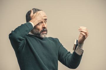 Senior man shocked with his blood pressure result