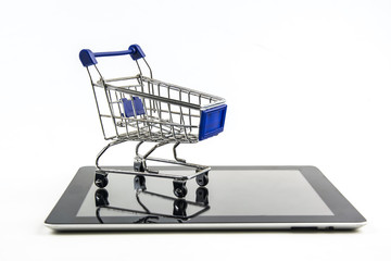 shopping cart with tablet on white backgrond , Means shopping online