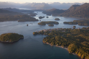 Bright sunny sunset at Tofino, Vancouver Island, British Columbia, Canada. Taken from an aerial view in the summer.