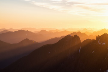 Beautiful rugged mountain landscape view during a golden sunset. Taken near Tofino, Vancouver Island, British Columbia, Canada.