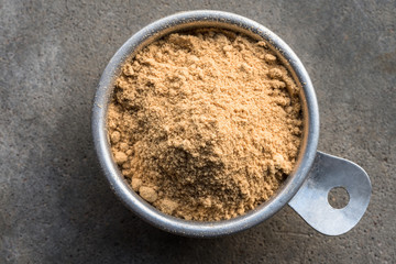 Ground Ginger in a Measuring Cup