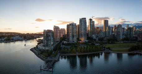 Fototapeta premium Aerial Panorama of Downtown City at False Creek, Vancouver, British Columbia, Canada. Taken during a bright sunset.