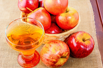 Apple cider glass and red apples