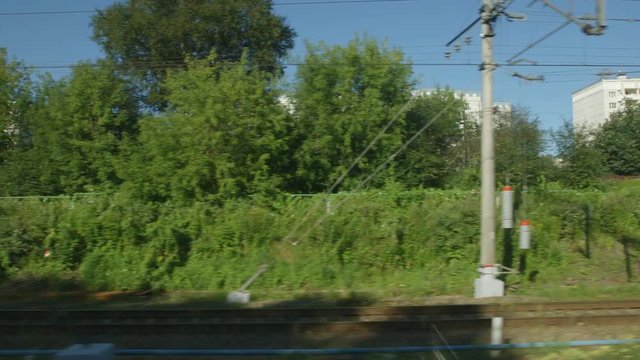 POV: High-speed Train moves past a town